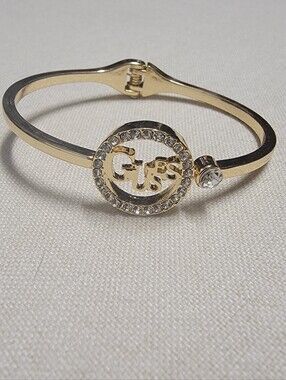 Guess Gold Tone Hinge Bangle Rhinestone Logo Bracelet
